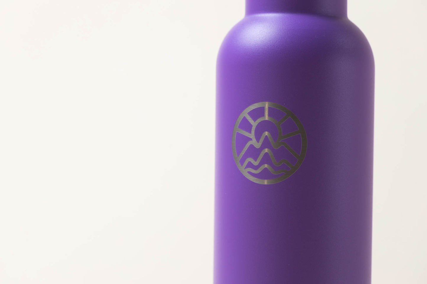 McClumsy 24oz Stainless Steel Purple Water Bottle Top Front Closeup View of Logo