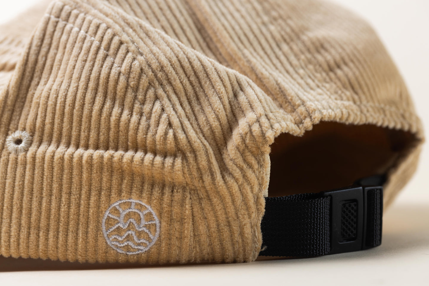 Back View of a McClumsy 5 Panel Light Tan Corduroy Hat with a Nylon Strap and Clasp.