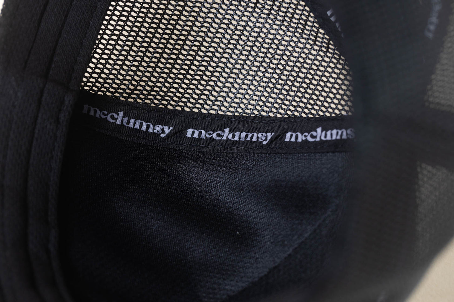 McClumsy Hat Brown Suede logo on gray black Inside Stitch