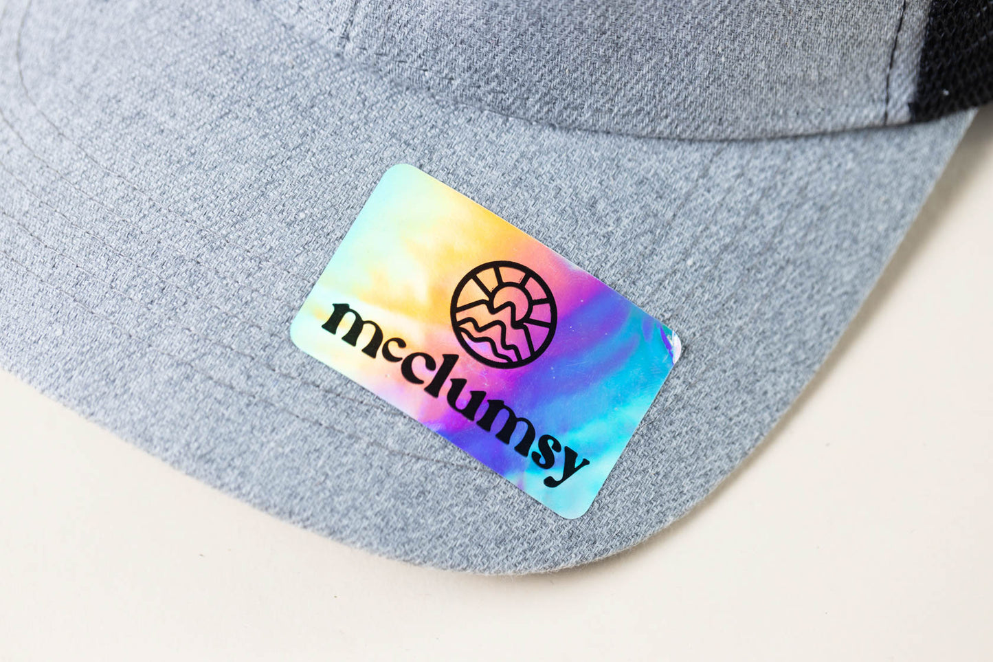McClumsy Hat Brown Suede logo on gray black Upper Bill