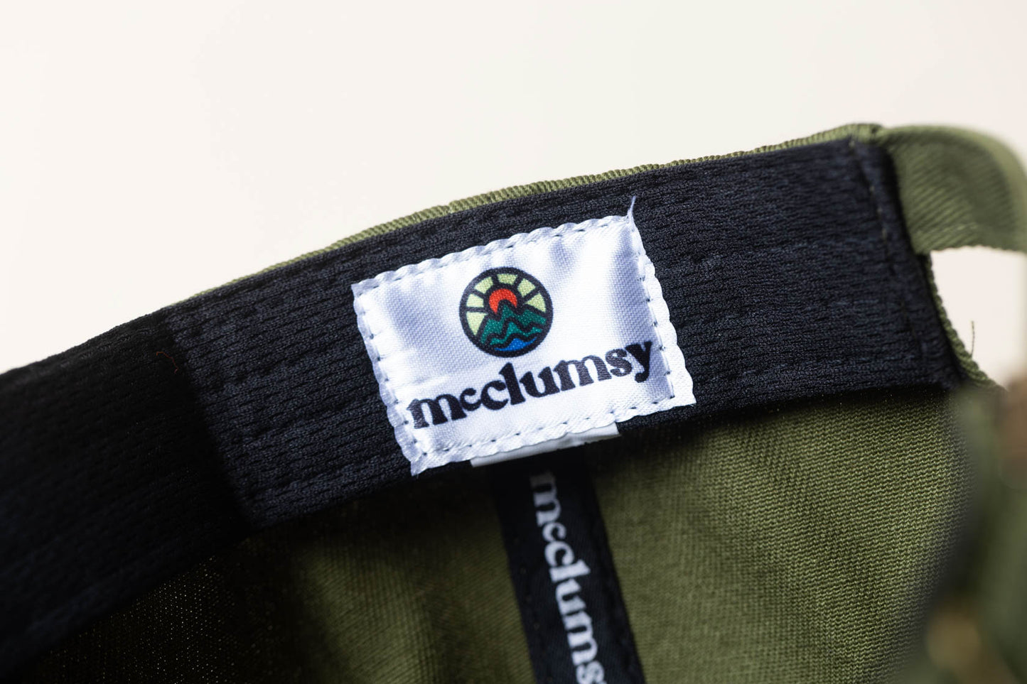 McClumsy Hat Full Color Logo on Forest Service Green Inside Logo Tag