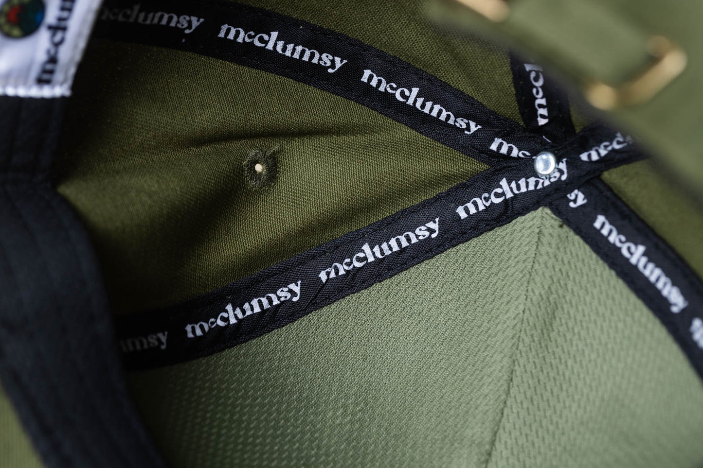 McClumsy Hat Full Color Logo on Forest Service Green Inside Tap