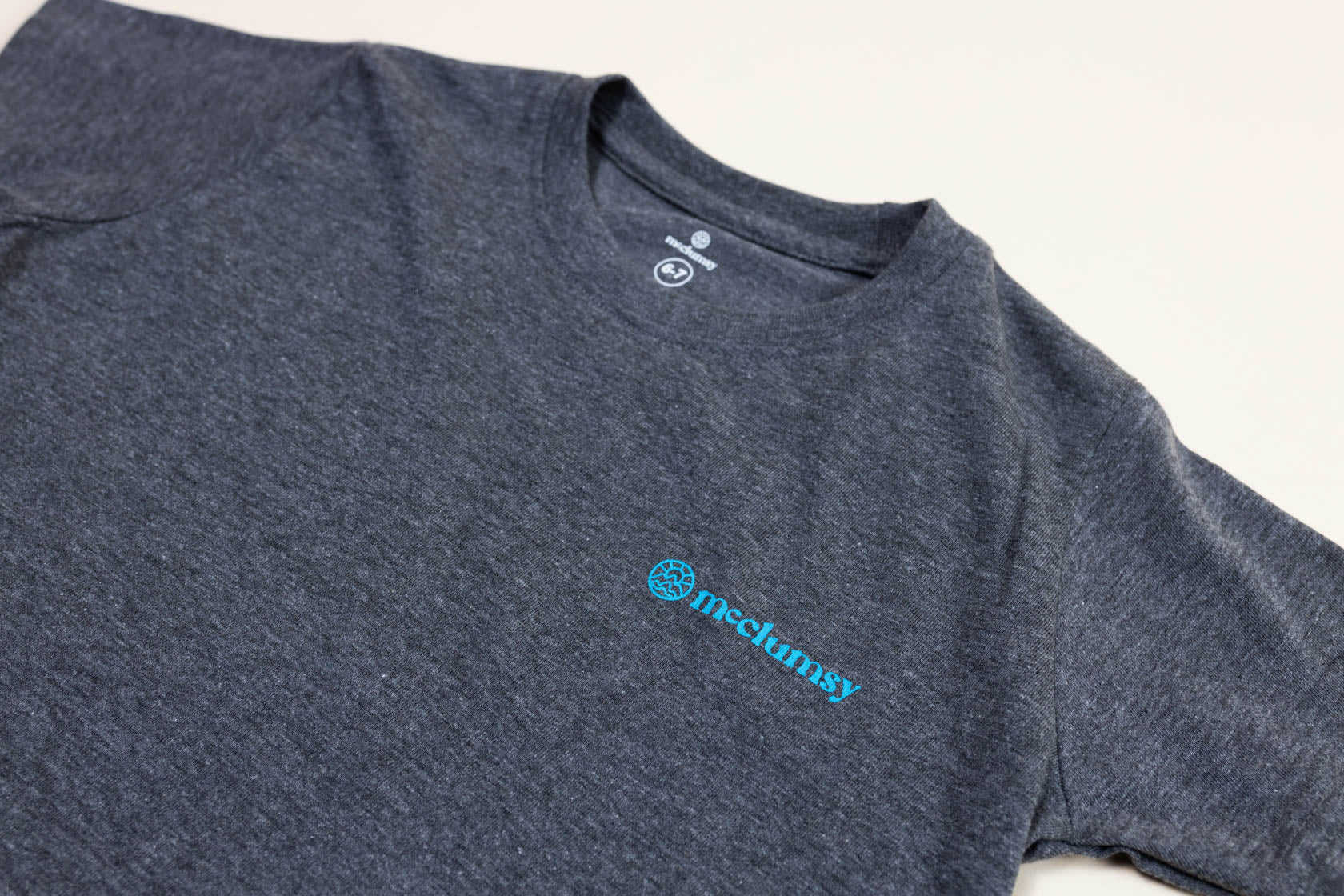 McClumsy T Dark Grey Blue Logo Front Close