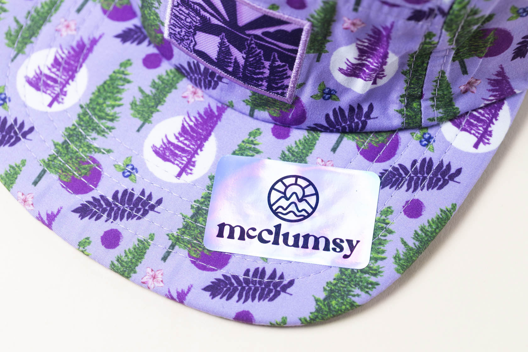McClumsy Roaring Plains Crushable Camper Hat Purple Upper Bill with Sticker