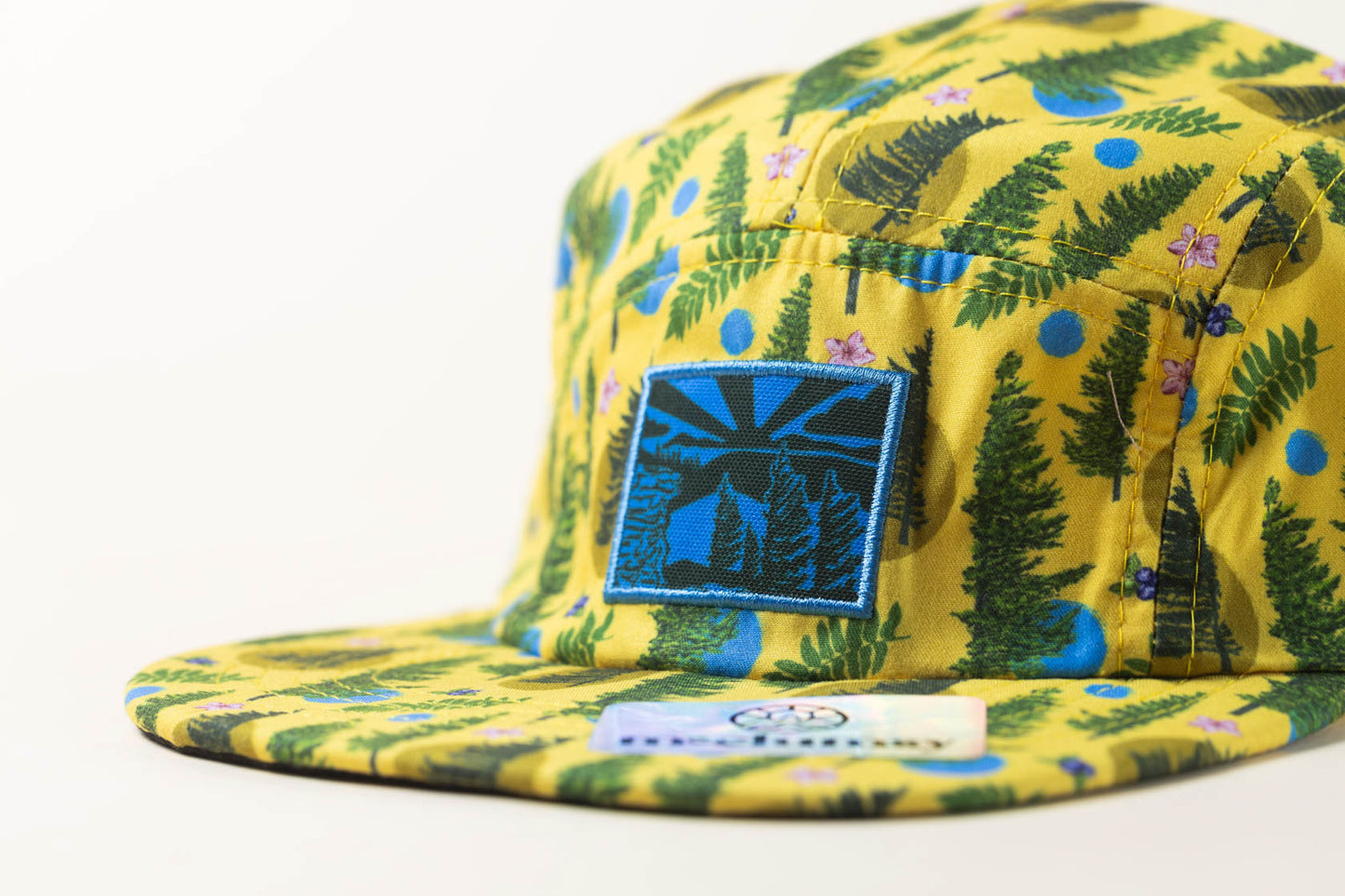 McClumsy Roaring Plains Crushable Camper Hat Yellow Closeup Patch with Flag Spruce