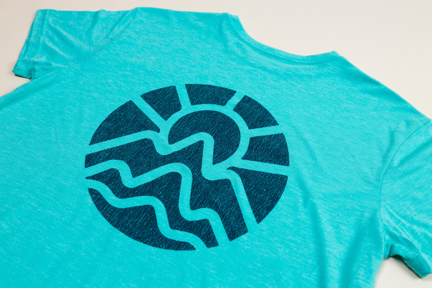 McClumsy Tee Caribbean Blue Triblend Back Logo Close Up