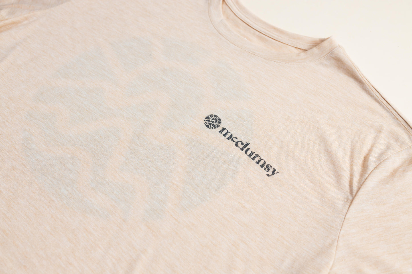 McClumsy Tee Nude TriBlend Front Closeup Logo