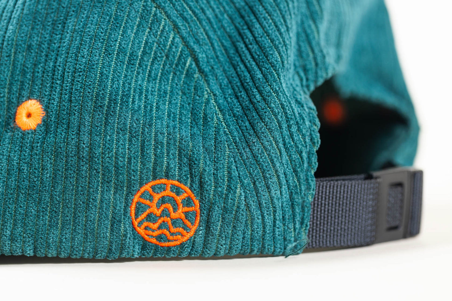 Back view of a McClumsy 5-Panel green corduroy hat and nylon strap