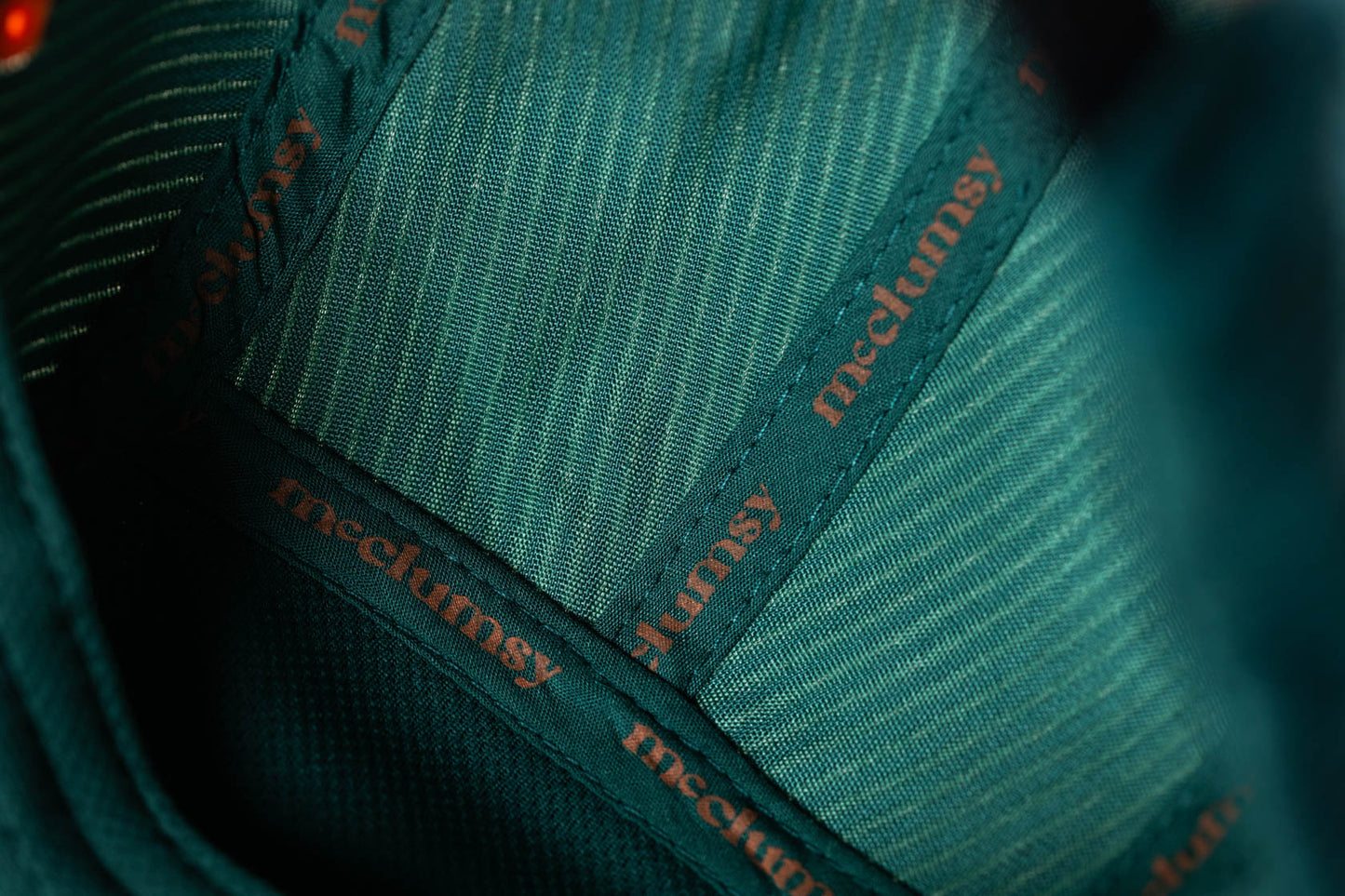 Close up view of the seam tape on the inside of the McClumsy 5-Panel Rich Green Corduroy Hat